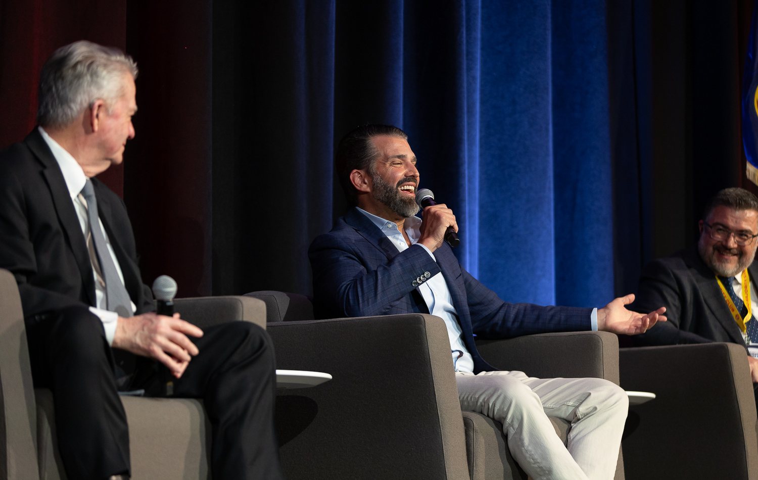 Gregory Graf on stage with Donald Trump Jr. and the Idaho governor at an Idaho leadership event