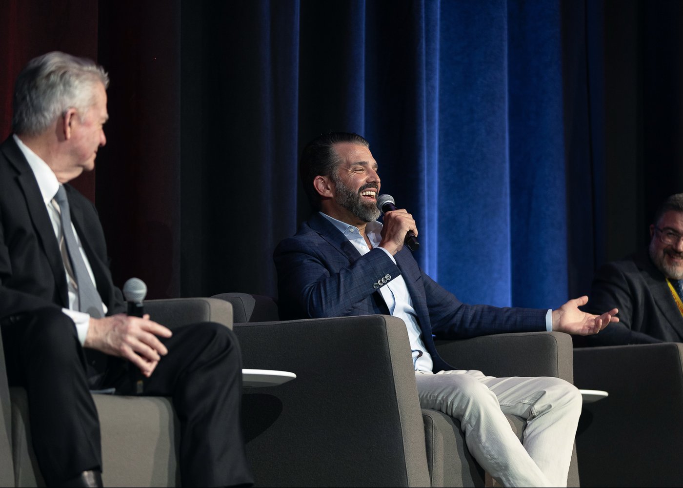 Gregory Graf on stage with Donald Trump Jr. at an Idaho leadership event